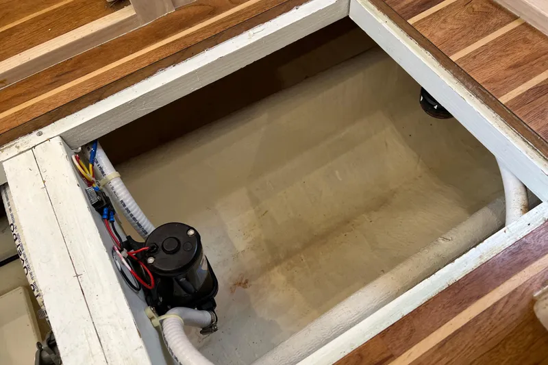 Slide: The Image of Bilge compartment of 2004 Henriques 35 Sportfisherman with pump and wiring visible. - 65