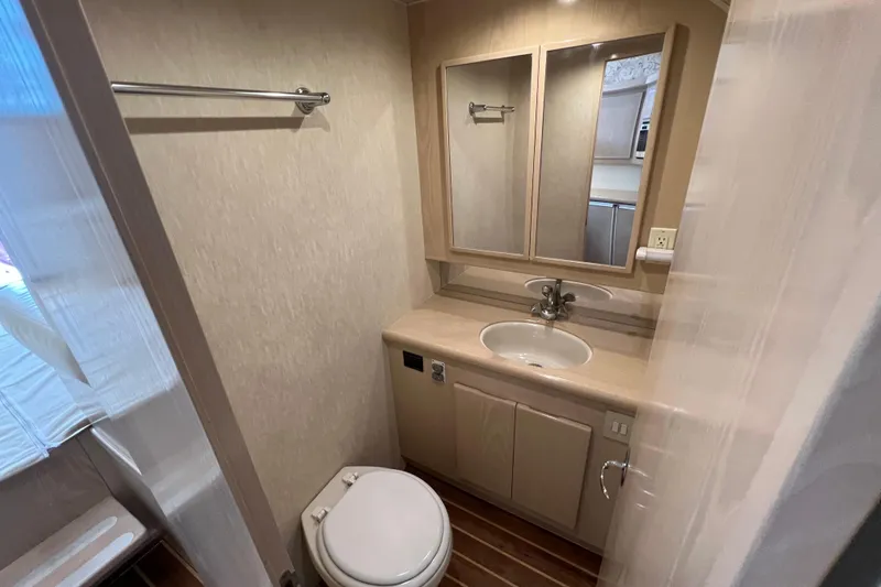 Slide: The Image of Bathroom interior of 2004 Henriques 35 Sportfisherman with sink, mirror, and toilet. - 66