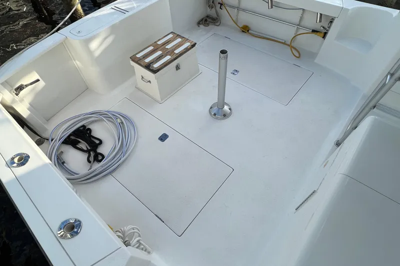 Slide: The Image of 2004 Henriques 35 Sportfisherman deck with storage, hose, and seating. - 7