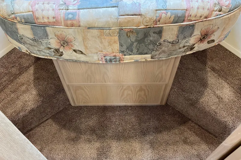 Slide: The Image of Interior cabin of 2004 Henriques 35 Sportfisherman with floral upholstery and carpeted flooring. - 74