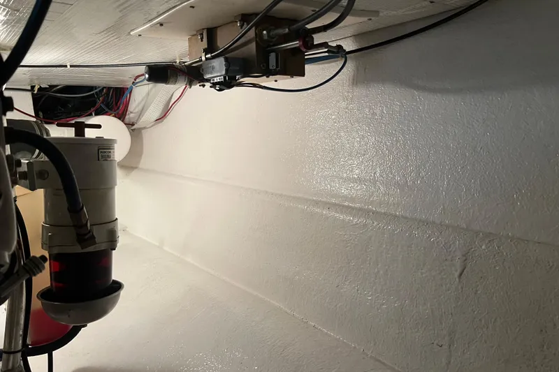 Slide: The Image of Engine room of 2004 Henriques 35 Sportfisherman with visible wiring and components. - 88