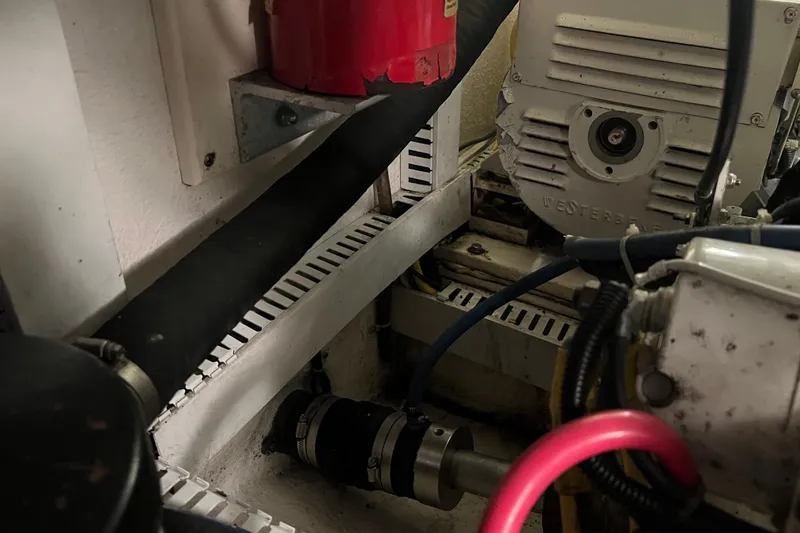 Slide: The Image of Engine room of 2004 Henriques 35 Sportfisherman, featuring mechanical components and wiring. - 97