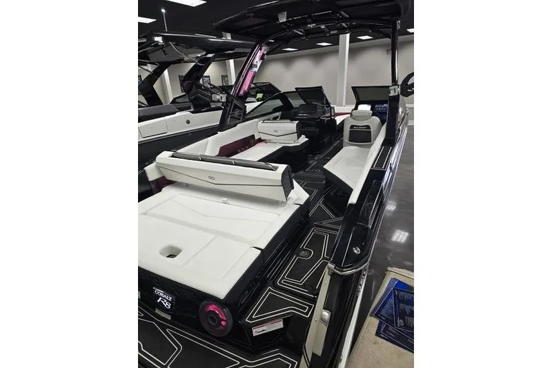Slide: The Image of 2026 Cobalt R8 Surf boat interior with sleek seating and modern design. - 4