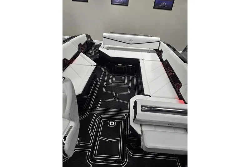 Slide: The Image of 2026 Cobalt R8 Surf boat interior with sleek white seating and modern design. - 6