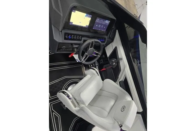 Slide: The Image of 2026 Cobalt R8 Surf boat cockpit with modern steering and digital displays. - 9