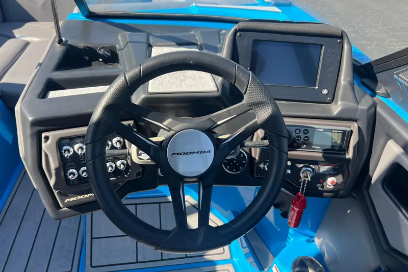 Slide: The Image of 2022 Moomba Kaiyen boat with black mesh sunshade, scenic background. - 16