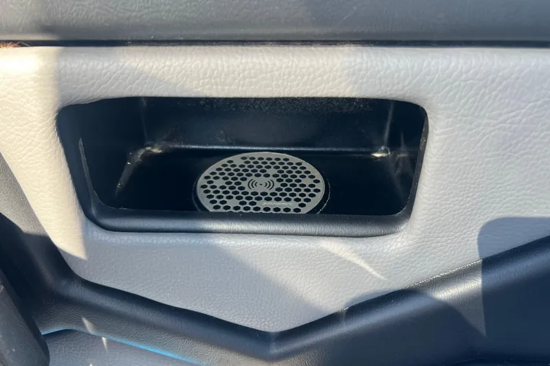 Slide: The Image of 2022 Moomba Kaiyen boat interior with blue and gray seating and dashboard. - 26