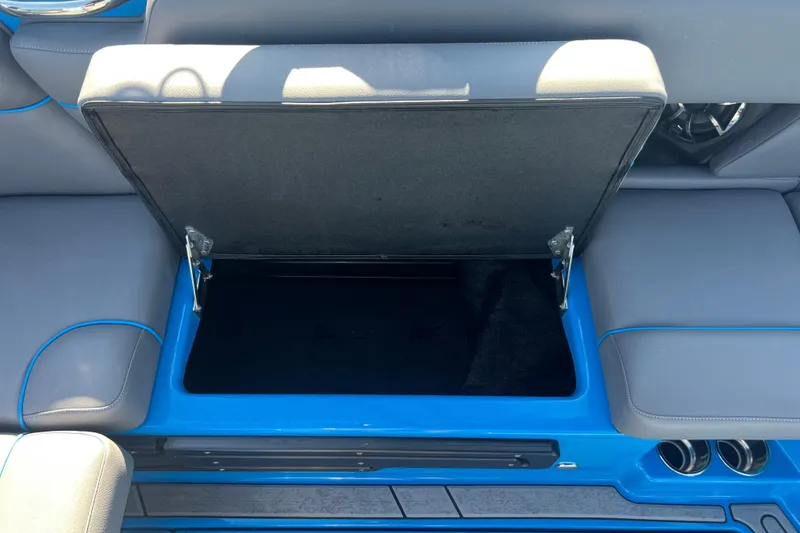 Slide: The Image of 2022 Moomba Kaiyen boat interior with steering wheel and control panel. - 31