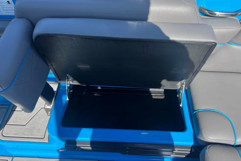 Slide: The Image of 2022 Moomba Kaiyen boat interior with steering wheel and captain's seat. - 32