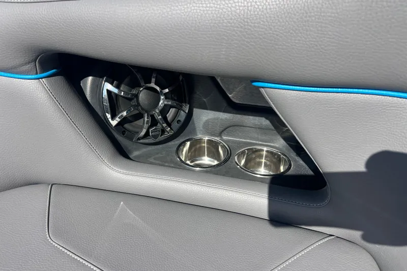 Slide: The Image of 2022 Moomba Kaiyen interior with phone holder and cup holder, blue finish. - 37