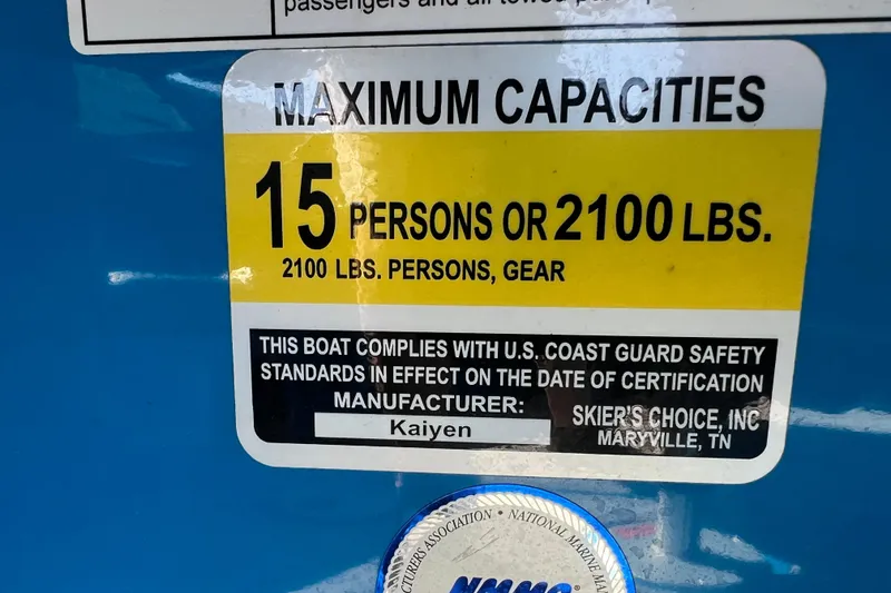 Slide: The Image of 2022 Moomba Kaiyen boat identification plate on blue surface. - 42