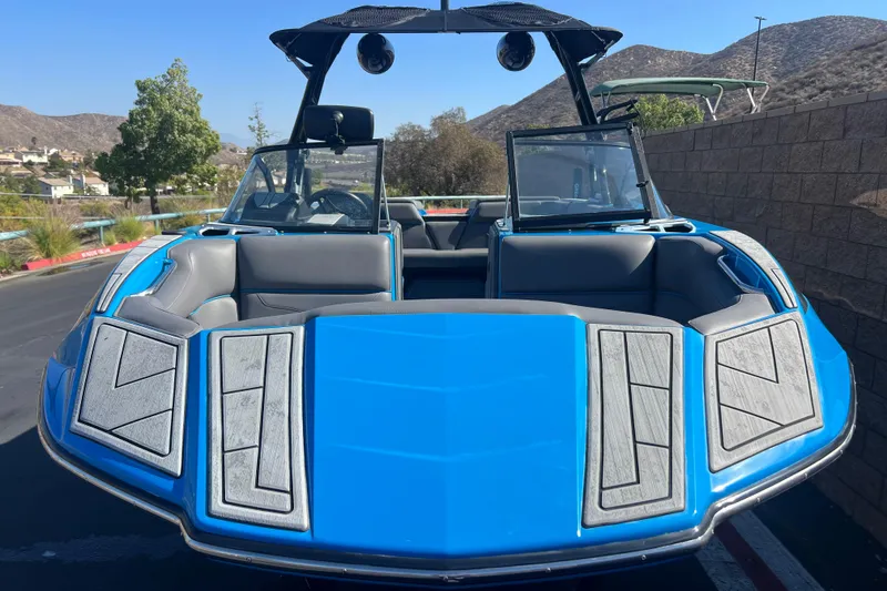 Slide: The Image of Rear view of a 2022 Moomba Kaiyen boat on a trailer, showcasing propeller and hull. - 7