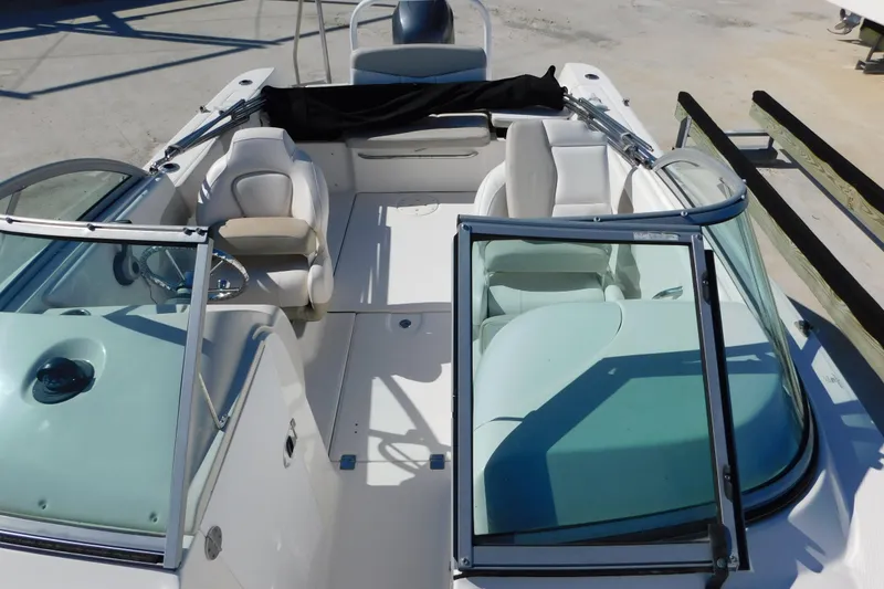 Slide: The Image of 2014 Robalo R207 Dual Console boat interior with seating and steering wheel. - 15