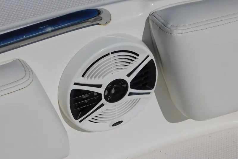 Slide: The Image of White speaker on 2014 Robalo R207 Dual Console boat interior. - 28