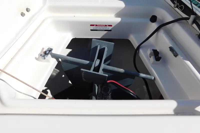 Slide: The Image of 2014 Robalo R207 Dual Console anchor storage compartment with visible wiring and hardware. - 29