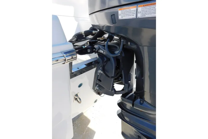 Slide: The Image of 2014 Robalo R207 Dual Console boat engine detail, showcasing motor and mounting components. - 8