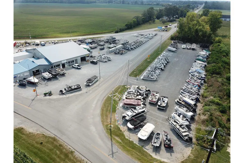 Slide: The Image of Aerial view of a boat dealership showcasing various boats, including the 2026 Barletta Aria 20L. - 8