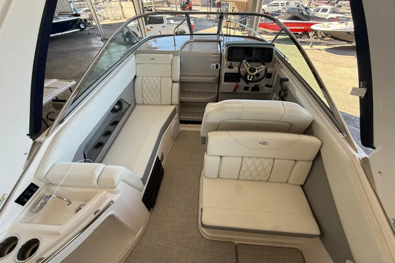 Slide: The Image of 2026 Regal 28 Express boat interior with plush seating and modern helm. - 21
