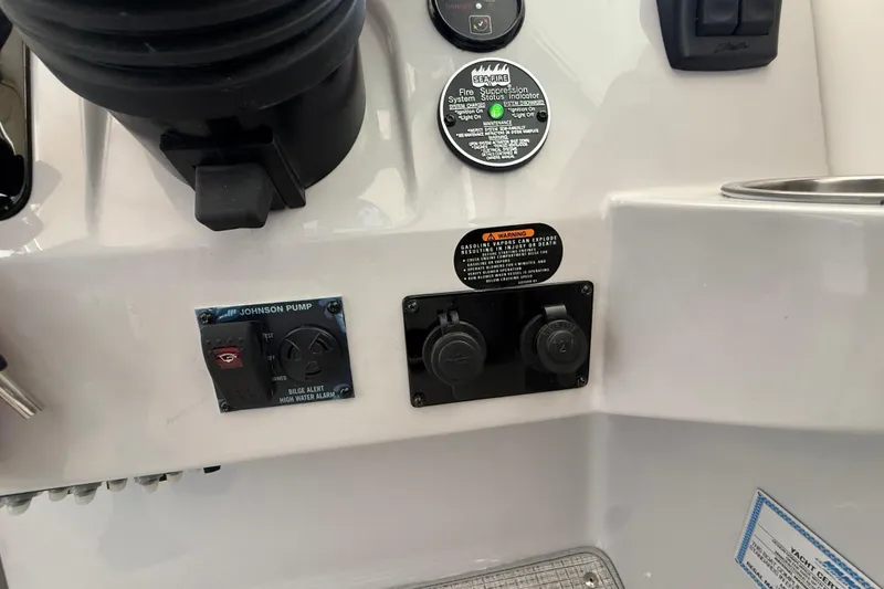 Slide: The Image of Control panel of 2026 Regal 28 Express boat with various switches and indicators. - 28