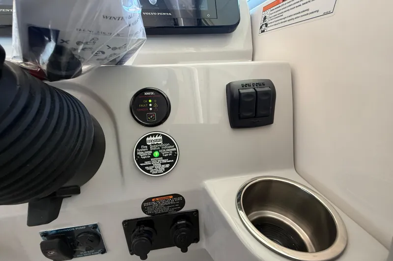 Slide: The Image of Control panel of 2026 Regal 28 Express boat with switches and indicators. - 29