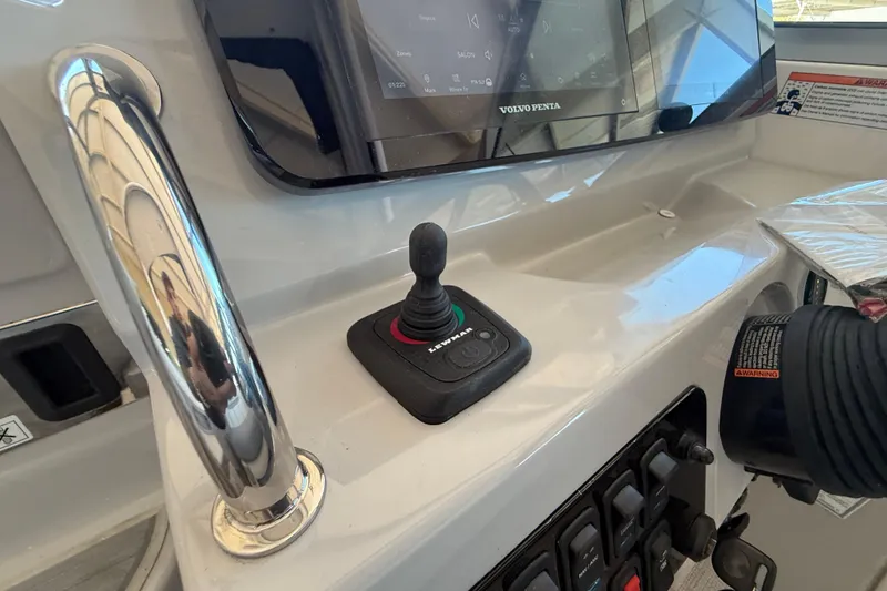 Slide: The Image of Control panel of 2026 Regal 28 Express boat with joystick and display. - 31