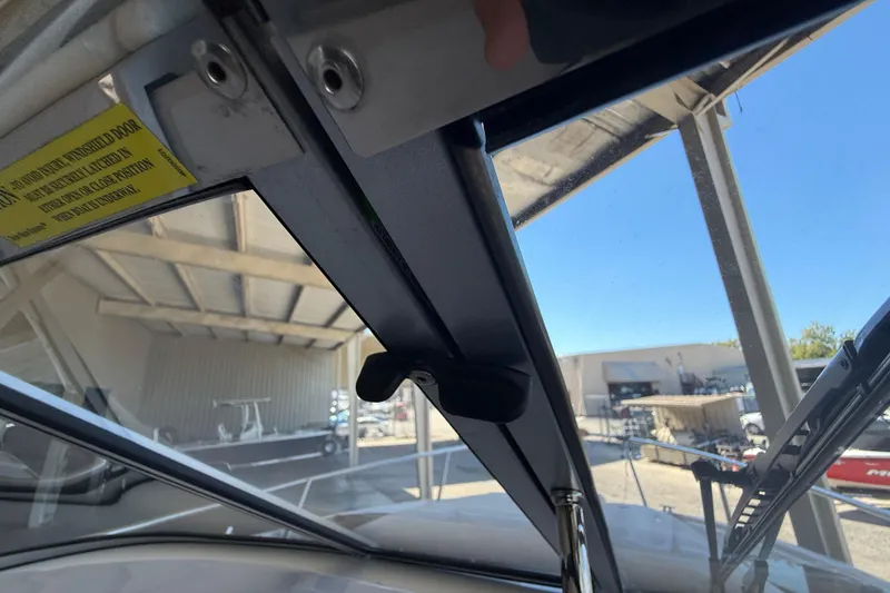 Slide: The Image of Interior view of 2026 Regal 28 Express boat windshield and wiper mechanism. - 33