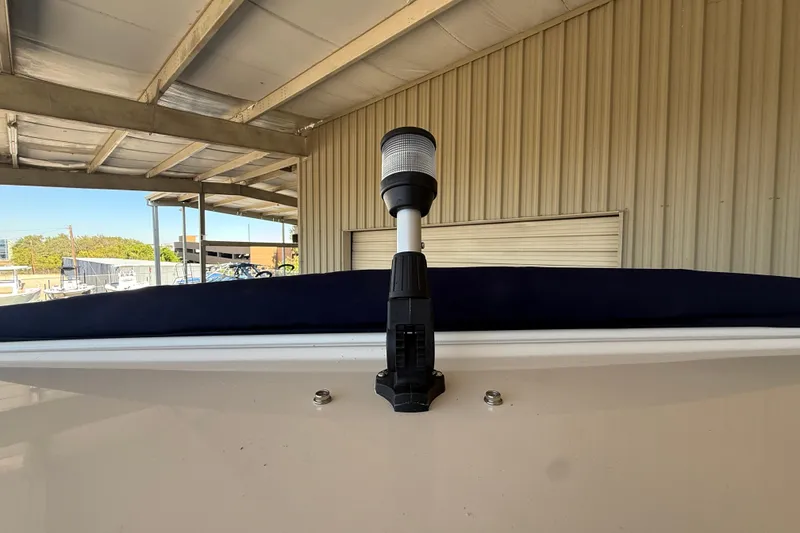 Slide: The Image of 2026 Regal 28 Express boat detail under a covered dock. - 37