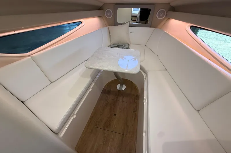 Slide: The Image of 2026 Regal 28 Express cabin interior with white seating and wooden flooring. - 39