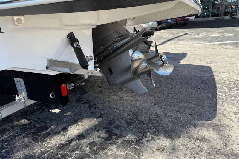 Slide: The Image of 2026 Regal 28 Express boat stern with propeller and outboard motor. - 4