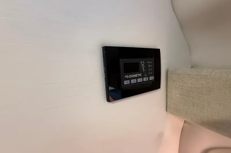 Slide: The Image of Dometic control panel in 2026 Regal 28 Express boat interior. - 40