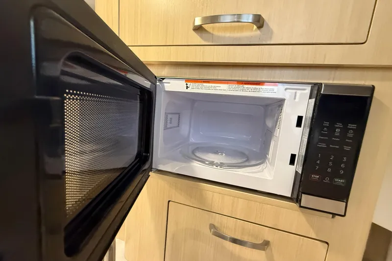 Slide: The Image of Open microwave in Regal 28 Express 2026, showcasing modern kitchen amenities. - 45