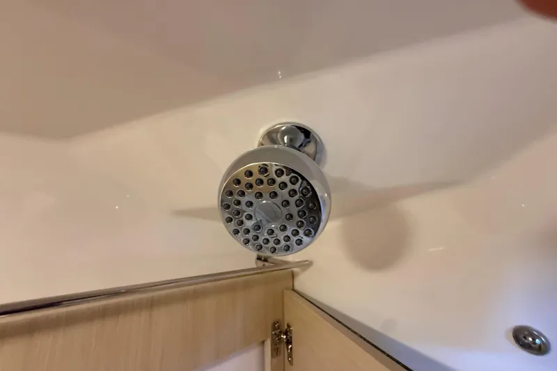 Slide: The Image of Showerhead in 2026 Regal 28 Express boat bathroom, featuring modern design and chrome finish. - 55