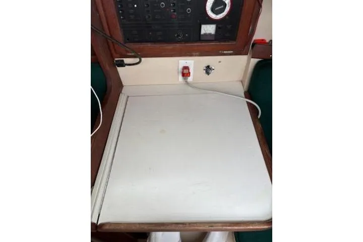 Slide: The Image of Navigation station of a 1989 Catalina 30 sailboat with control panel and wiring. - 11