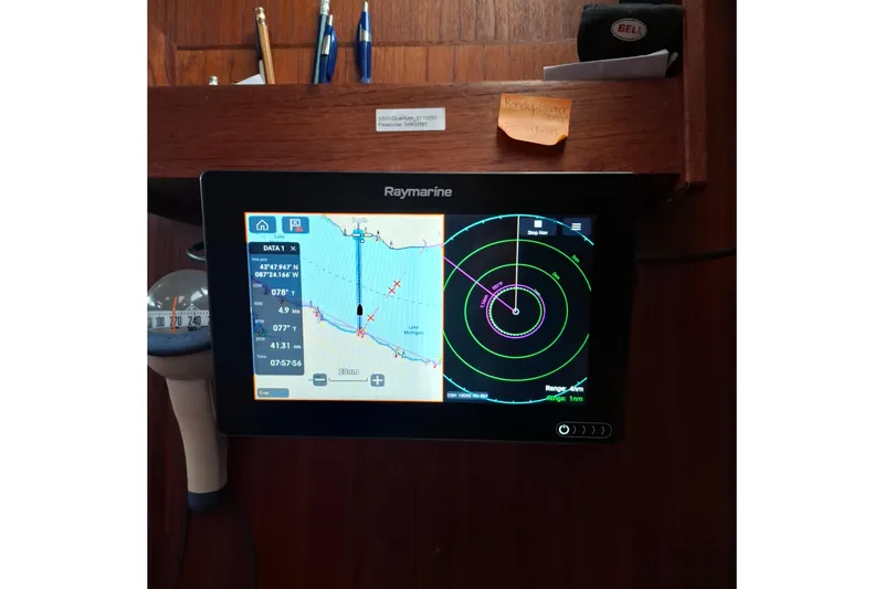Slide: The Image of Raymarine navigation display on 1989 Hunter 30 sailboat, showing map and radar data. - 13