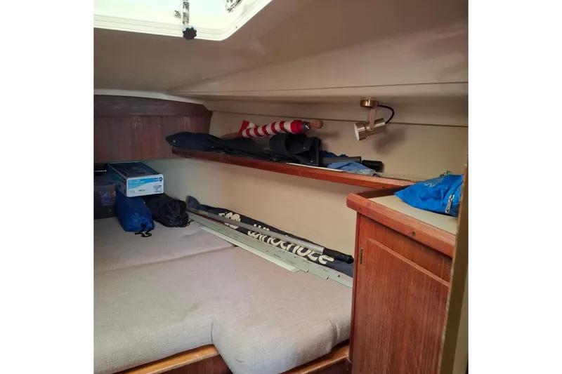 Slide: The Image of Interior cabin of 1989 Hunter 30 sailboat with storage and seating area. - 20