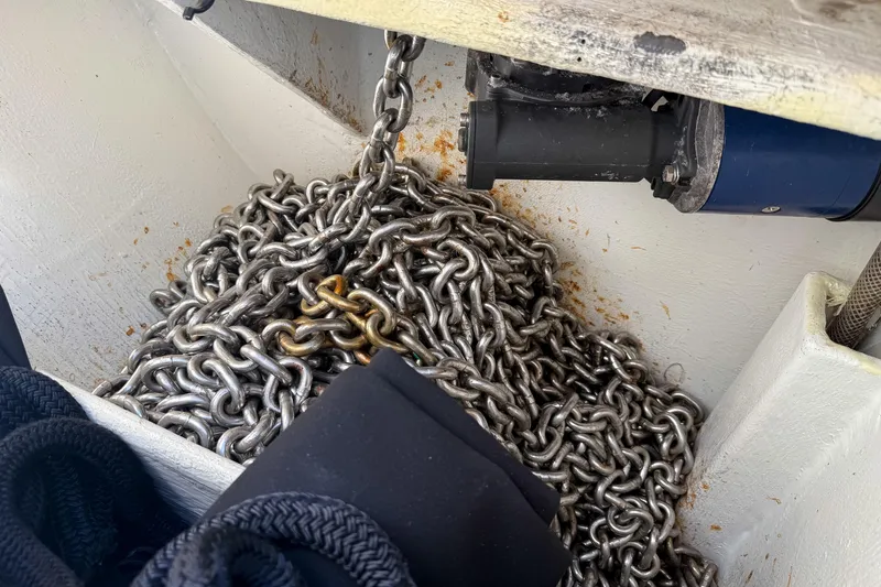 Slide: The Image of Anchor chain storage on 2017 Harvey Yachts 58, featuring robust metal links. - 104