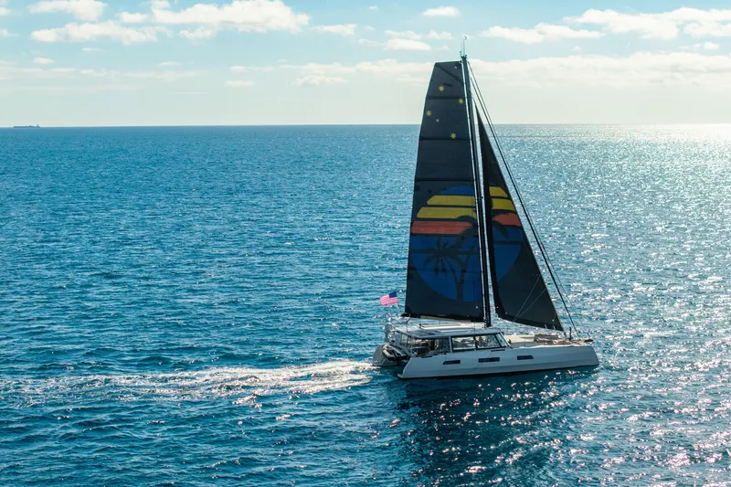 Slide: The Image of Sailing yacht Harvey Yachts 58 (2017) on open sea with colorful sail design. - 11