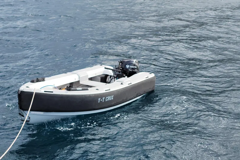 Slide: The Image of Small boat on water, Harvey Yachts 58, 2017 model, with Tohatsu motor. - 110