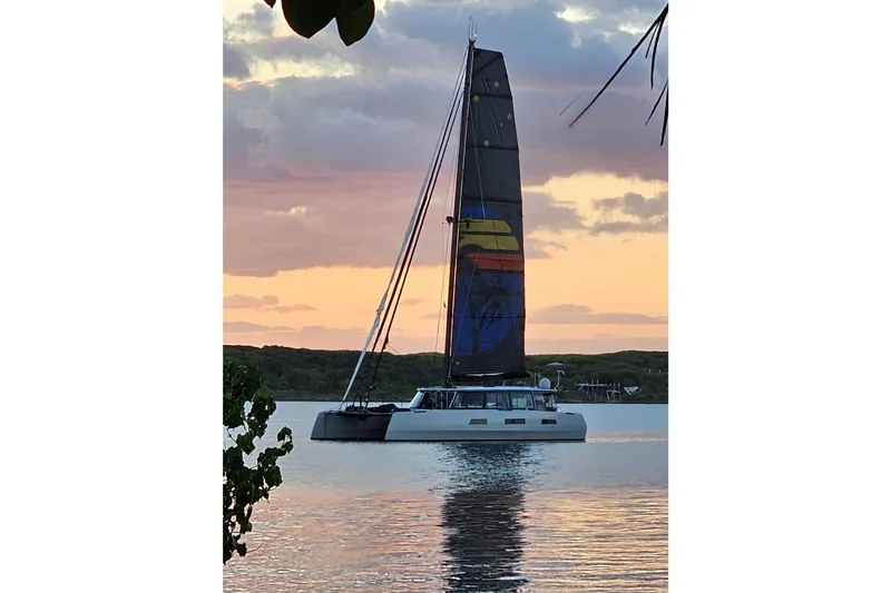 Slide: The Image of Sailing yacht Harvey Yachts 58, 2017 model, at sunset on calm waters. - 116