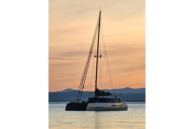 Slide: The Image of Sailing yacht Harvey Yachts 58, 2017 model, at sunset on calm waters. - 117