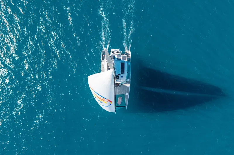 Slide: The Image of Aerial view of 2017 Harvey Yachts 58 sailing on clear blue ocean waters. - 12