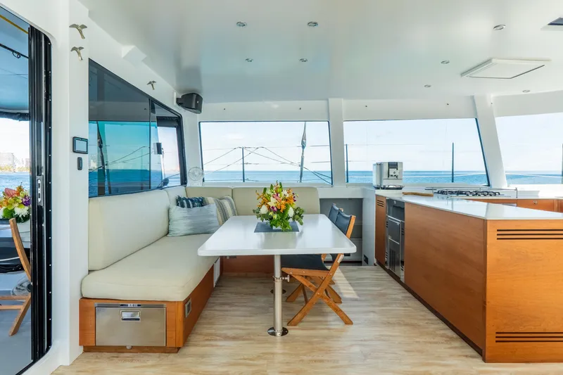 Slide: The Image of Luxurious interior of 2017 Harvey Yachts 58, featuring modern kitchen and dining area with ocean view. - 22