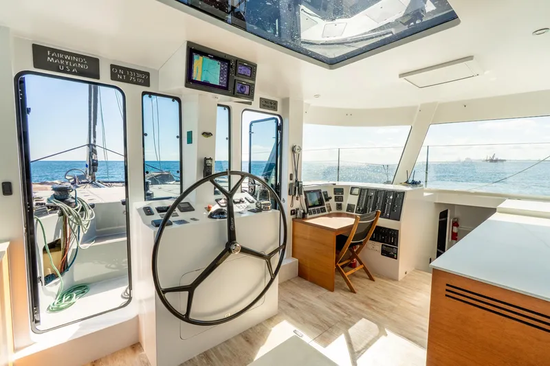 Slide: The Image of Luxurious helm of 2017 Harvey Yachts 58, featuring modern navigation equipment and ocean views. - 24