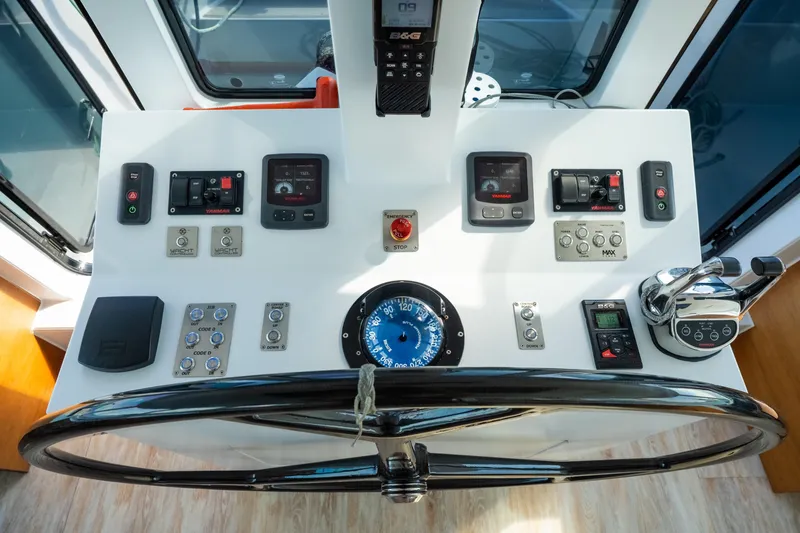 Slide: The Image of Helm of 2017 Harvey Yachts 58 with navigation controls and steering wheel. - 26