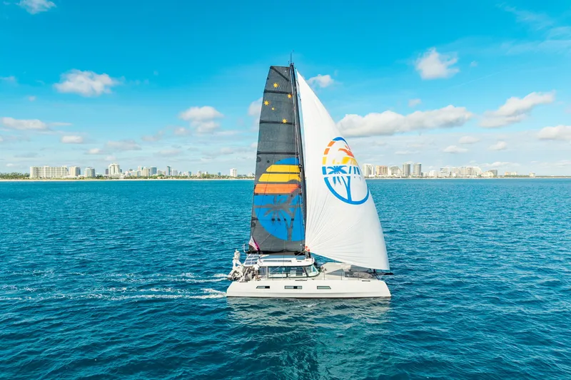 Slide: The Image of Sailing yacht Harvey Yachts 58 (2017) cruising on blue ocean near city skyline. - 3