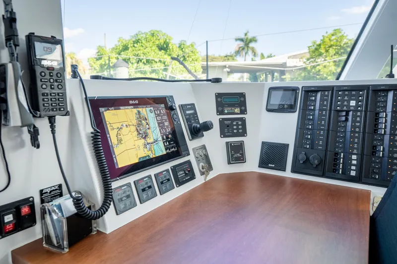 Slide: The Image of Cockpit of 2017 Harvey Yachts 58, featuring navigation and communication equipment. - 37
