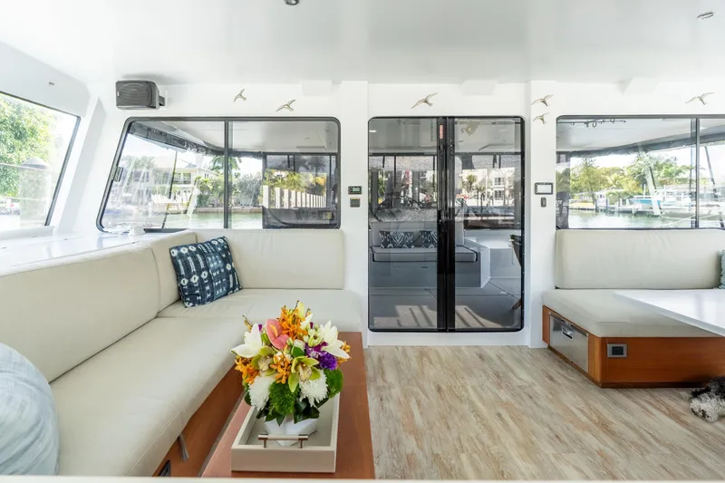 Slide: The Image of Luxurious interior of 2017 Harvey Yachts 58, featuring elegant seating and floral centerpiece. - 38