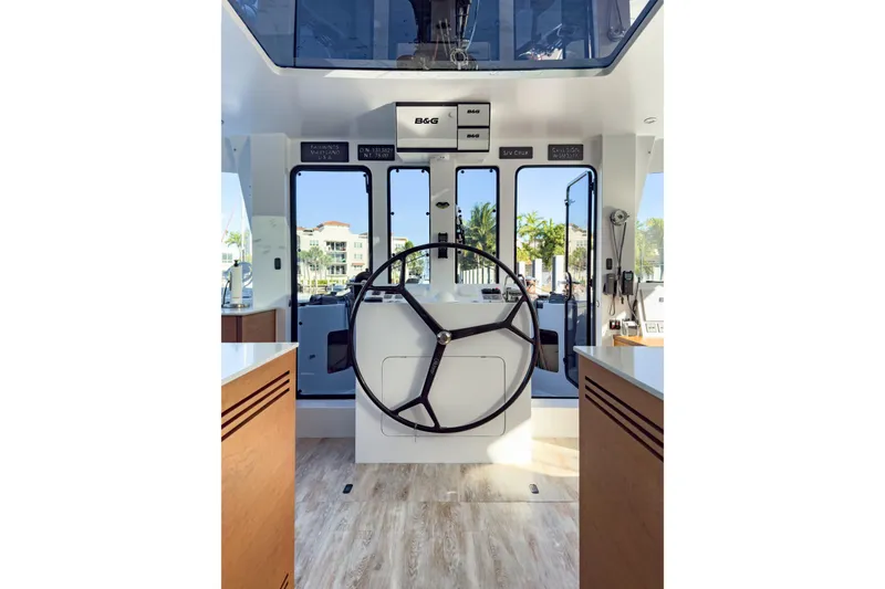 Slide: The Image of Helm of 2017 Harvey Yachts 58, featuring modern navigation equipment and spacious interior design. - 44