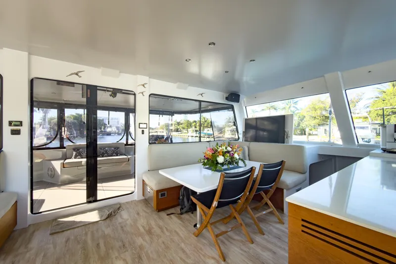 Slide: The Image of Luxurious interior of 2017 Harvey Yachts 58, featuring elegant dining area and panoramic windows. - 45