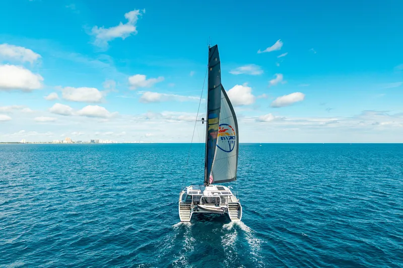 Slide: The Image of Sailing yacht Harvey Yachts 58, 2017 model, cruising on open blue sea under clear skies. - 5